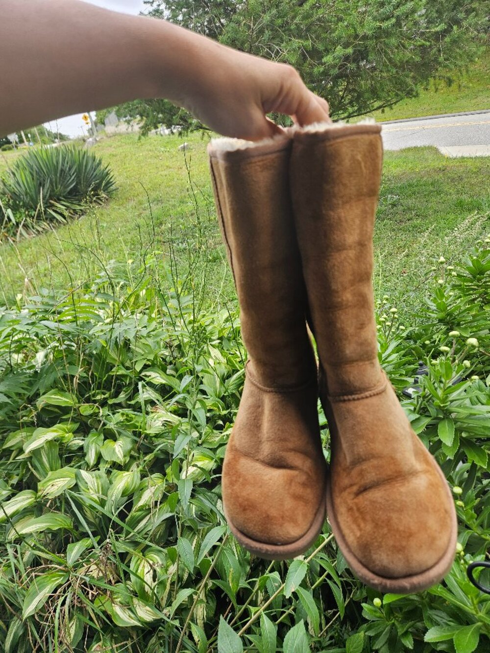 Tall brown UGG boot